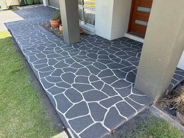 Charcoal flagstone-pattern concrete walkway